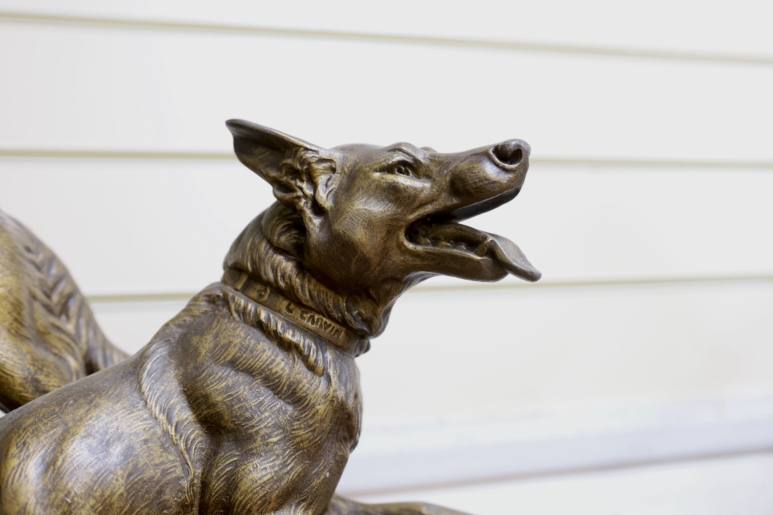 After Louis-Albert Carvin (1875–1951). A spelter Alsatian group on stepped marble base, 53cm tall